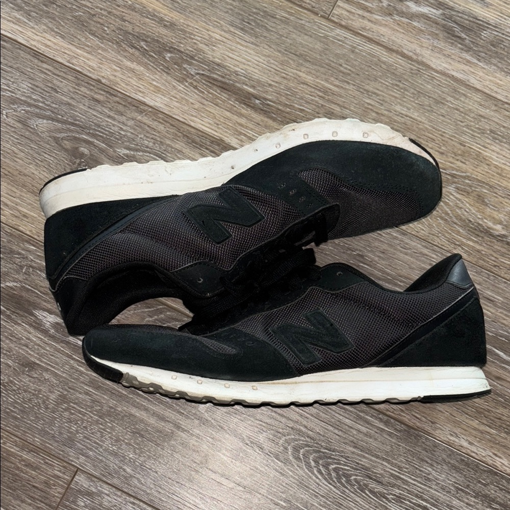 311’s New Balance Black and White Athletic Shoes Sleek Design